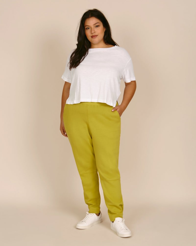 Front of a model wearing a size 0 Mia Jogger in Golden Lime by 11 Honoré Collection. | dia_product_style_image_id:218873